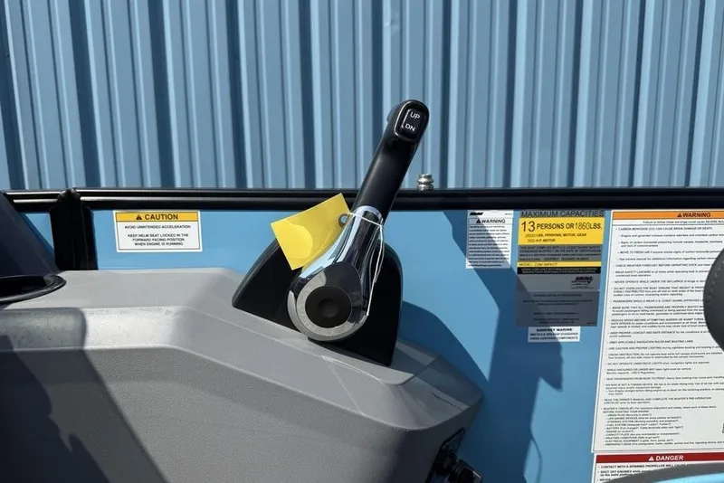 Slide: The Image of Throttle control and safety warnings on 2026 Godfrey Sweetwater 2286 SFL boat. - 31