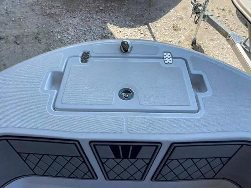 Slide: The Image of 2024 Wellcraft 202 Fisherman boat deck with storage compartment and rod holders. - 3