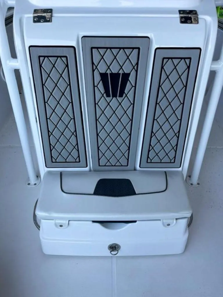 Slide: The Image of 2024 Wellcraft 202 Fisherman boat seat with storage compartment. - 6