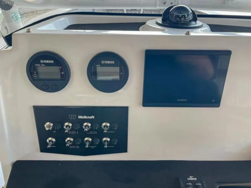Slide: The Image of Wellcraft 202 Fisherman 2024 dashboard with Yamaha gauges and Garmin display. - 8