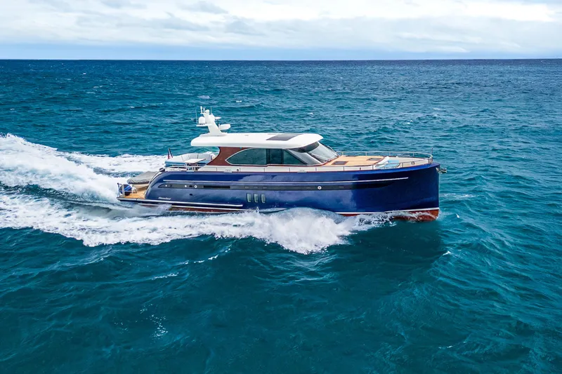 Slide: The Image of Luxury 2021 Steeler 60S Performance yacht cruising on open sea. - 11