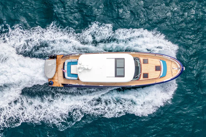 Slide: The Image of Aerial view of 2021 Steeler 60S Performance yacht cruising on the ocean. - 13