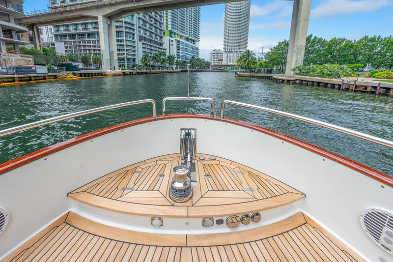 Slide: The Image of Bow view of 2021 Steeler 60S Performance yacht in urban waterway setting. - 23