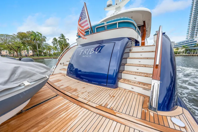 Slide: The Image of Luxury Steeler 60S Performance yacht, 2021 model, docked with American flag and wooden deck. - 24