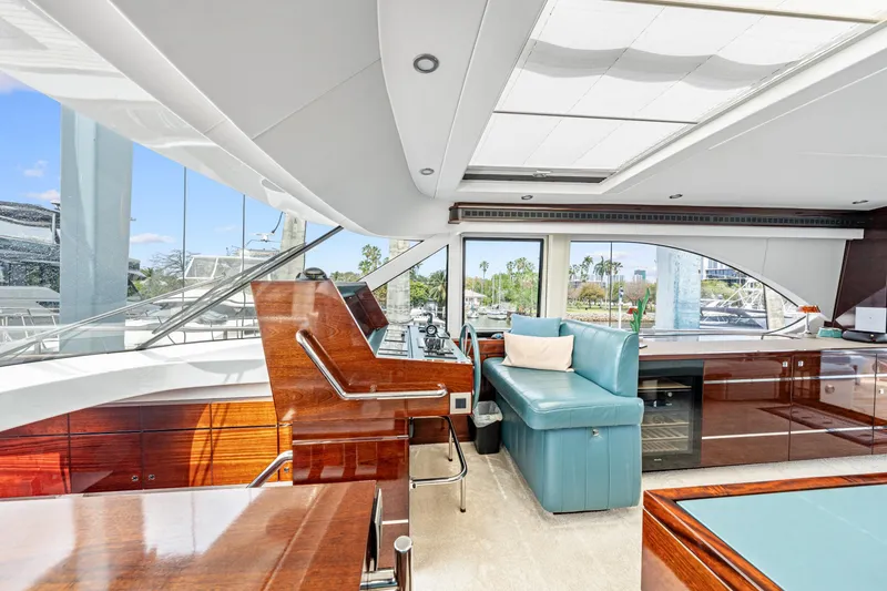 Slide: The Image of Luxurious interior of 2021 Steeler 60S Performance yacht with elegant seating and panoramic windows. - 29