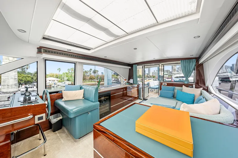 Slide: The Image of Luxurious interior of 2021 Steeler 60S Performance yacht with modern seating and panoramic windows. - 3