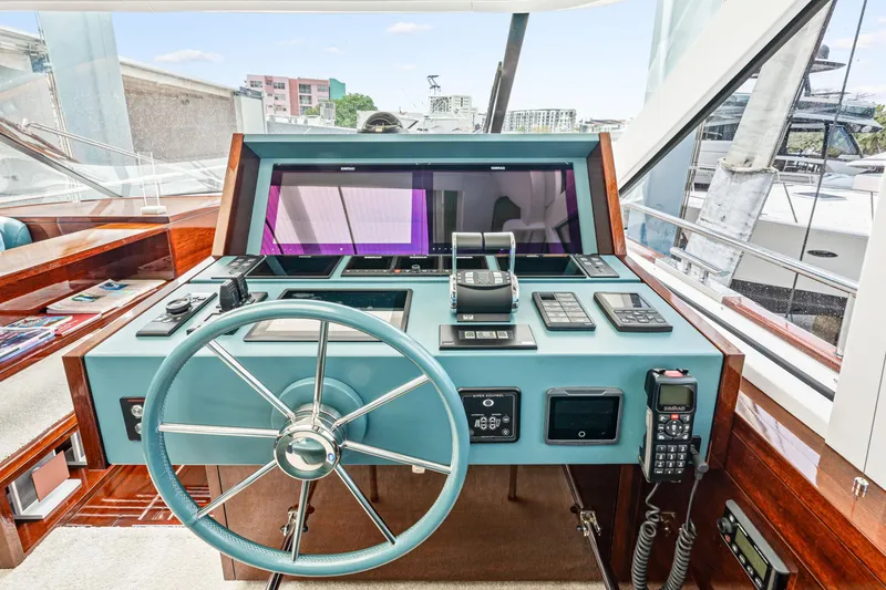 Slide: The Image of Helm of 2021 Steeler 60S Performance yacht with modern navigation controls. - 31