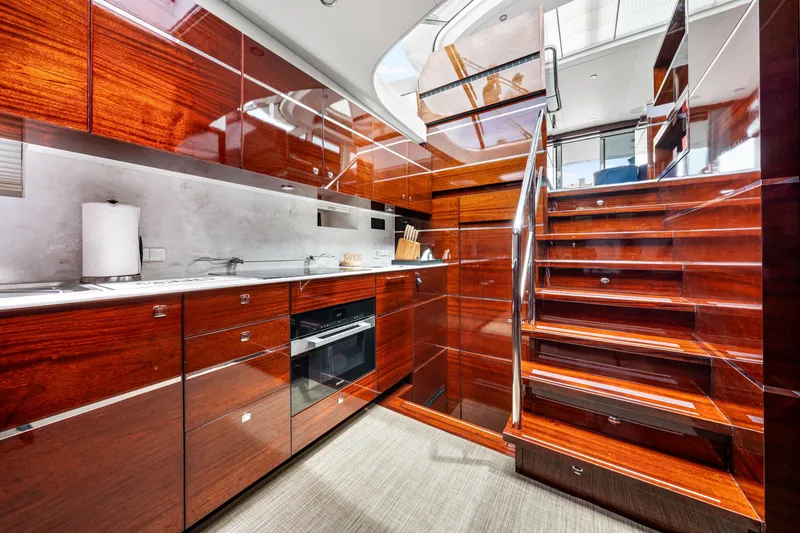 Slide: The Image of Luxurious interior of 2021 Steeler 60S Performance yacht with sleek wooden cabinetry and modern staircase. - 37
