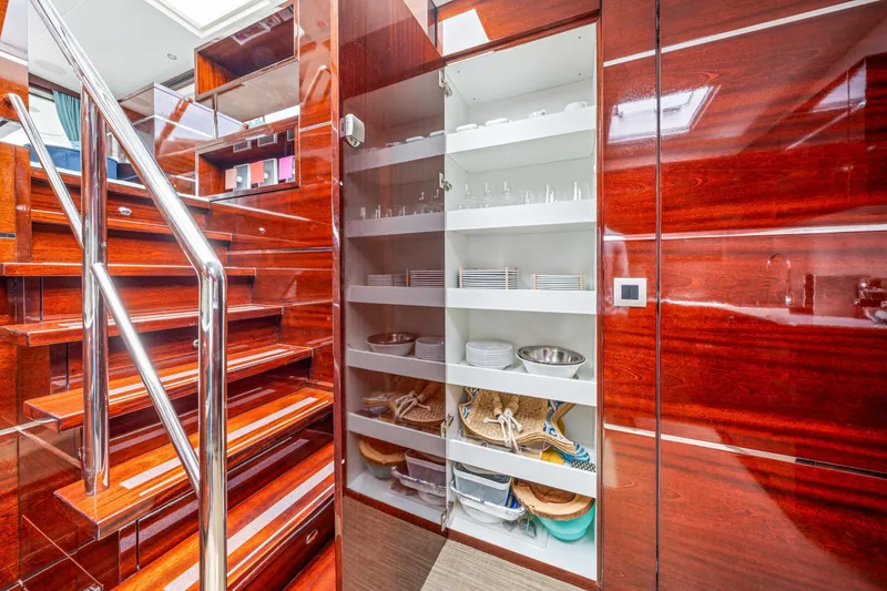 Slide: The Image of Luxurious interior of 2021 Steeler 60S Performance yacht with elegant wooden staircase and storage. - 40