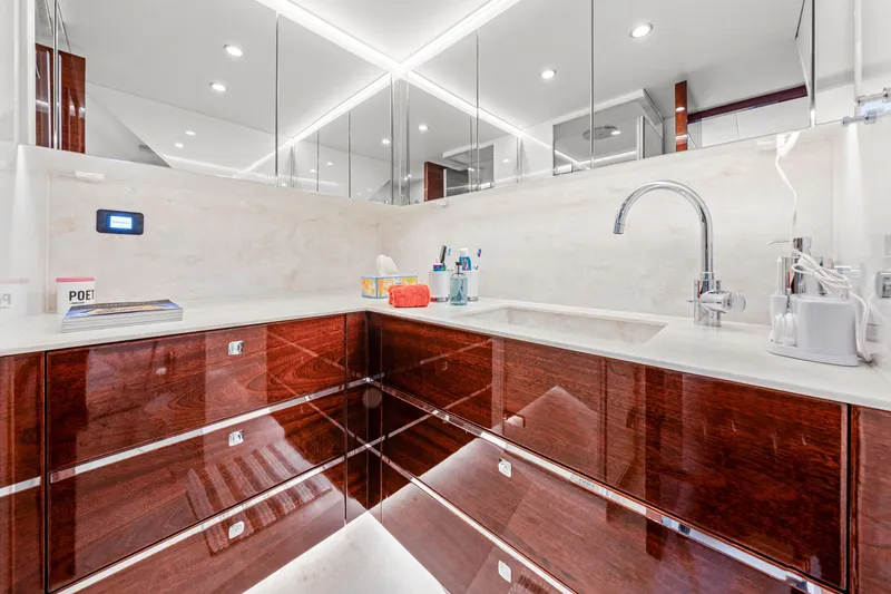 Slide: The Image of Luxurious bathroom on 2021 Steeler 60S Performance yacht with sleek wood cabinetry and modern fixtures. - 45