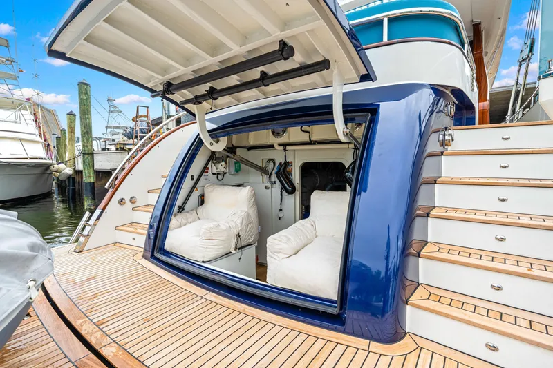 Slide: The Image of Luxury yacht Steeler 60S Performance 2021 with open storage compartment and wooden deck. - 51