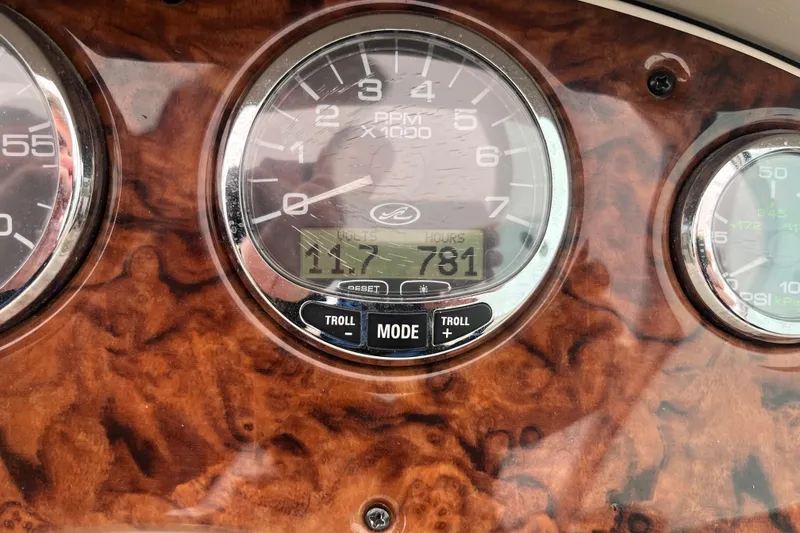 Slide: The Image of Close-up of 2004 Sea Ray 220 Sundeck dashboard gauges. - 13