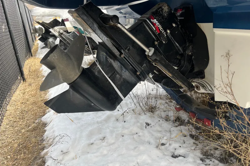 Slide: The Image of Close-up of 2004 Sea Ray 220 Sundeck propeller in snowy outdoor setting. - 34