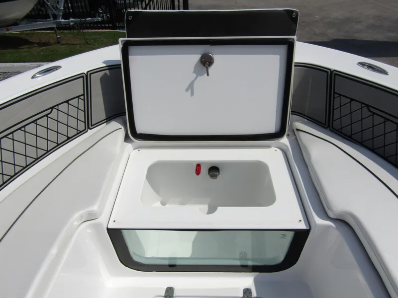 Slide: The Image of 2024 Wellcraft 202 Fisherman boat storage compartment with open lid. - 7