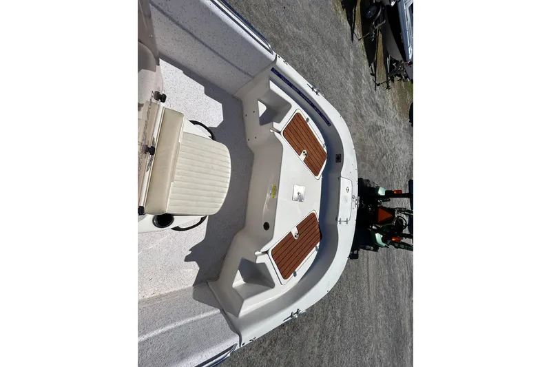 Slide: The Image of 2020 Carolina Skiff 178 DLV boat interior with seating and storage compartments. - 16