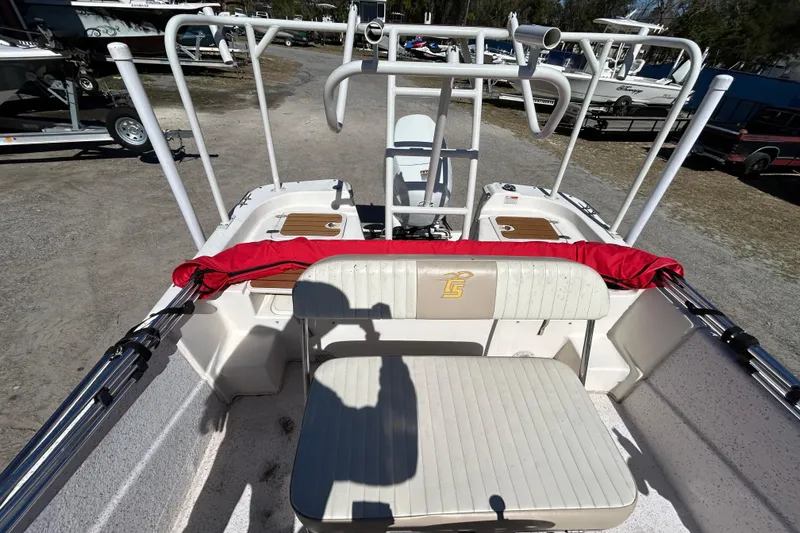 Slide: The Image of 2020 Carolina Skiff 178 DLV boat interior with seating and fishing rod holders. - 18
