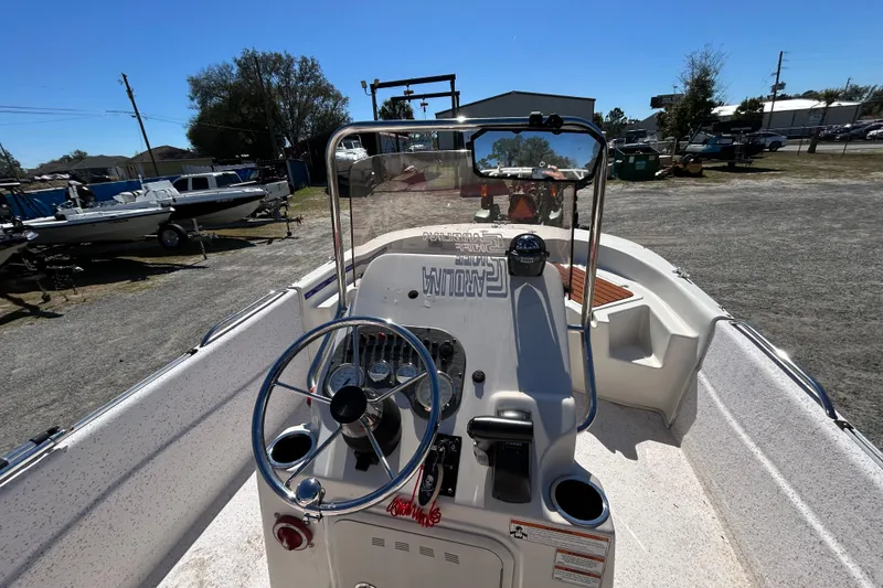 Slide: The Image of 2020 Carolina Skiff 178 DLV boat interior with steering console and controls. - 9