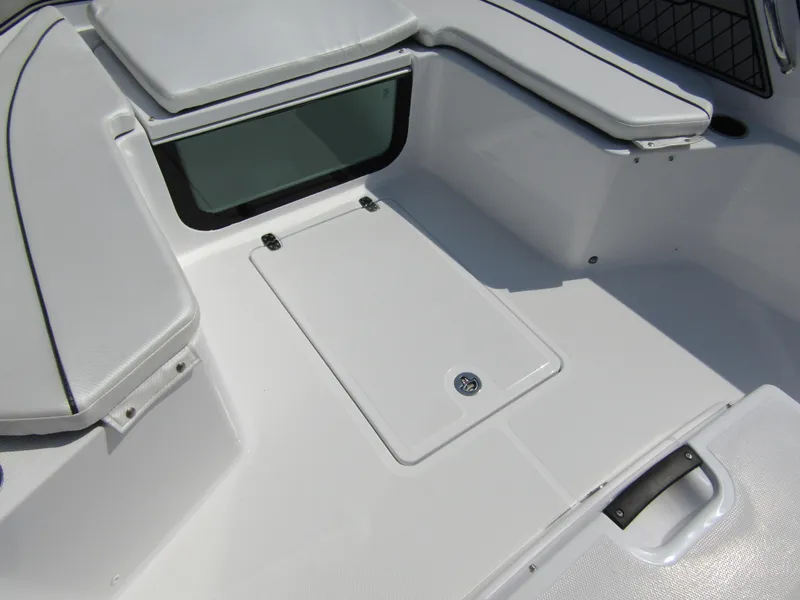 Slide: The Image of 2024 Wellcraft 202 Fisherman boat interior with seating and storage compartments. - 11