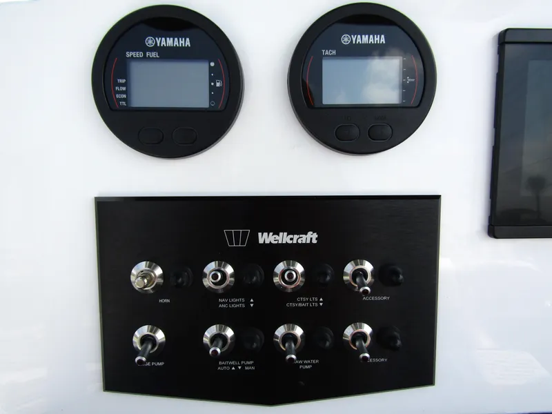 Slide: The Image of Dashboard of 2024 Wellcraft 202 Fisherman with Yamaha gauges and control switches. - 16
