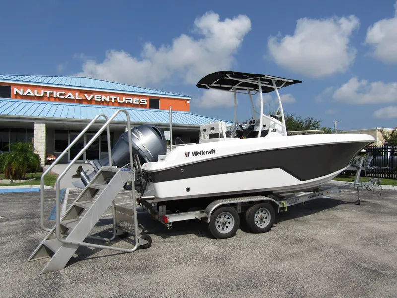 Slide: The Image of 2024 Wellcraft 202 Fisherman boat on trailer at Nautical Ventures dealership. - 2