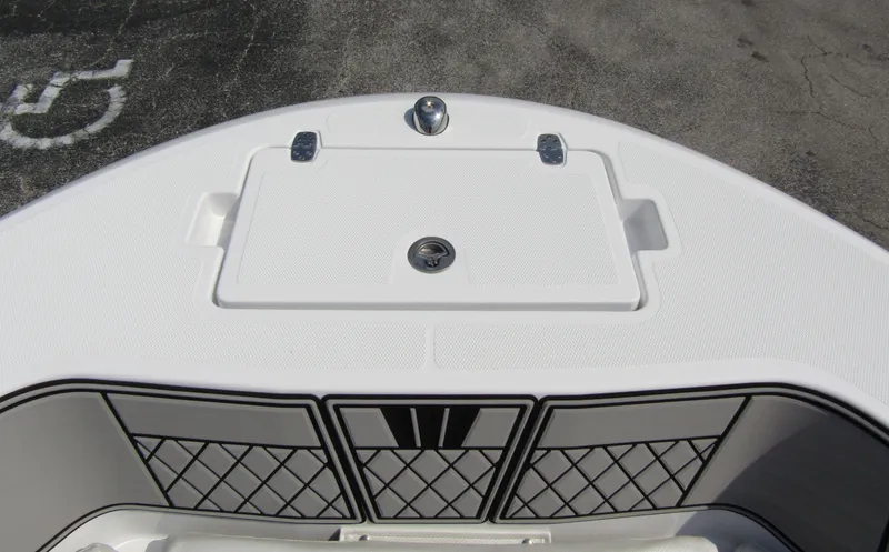 Slide: The Image of 2024 Wellcraft 202 Fisherman boat deck with storage compartment and netted side panels. - 4