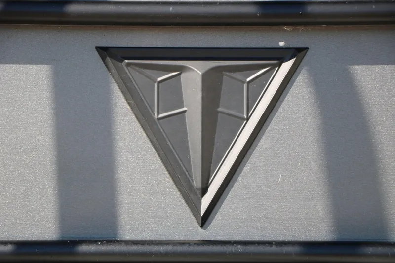 Slide: The Image of 2023 Trifecta 22 RFC logo on metallic surface, featuring a geometric triangular design. - 14