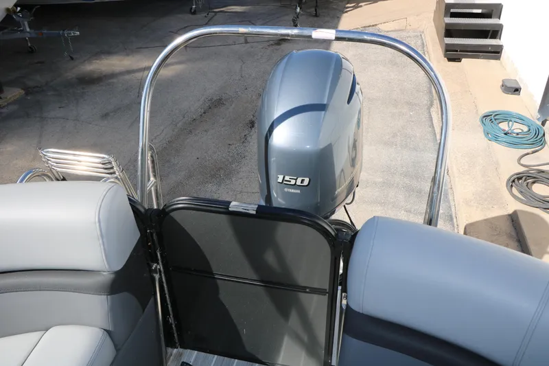 Slide: The Image of 2023 Trifecta 22 RFC boat with Yamaha 150 outboard motor, rear seating view. - 44