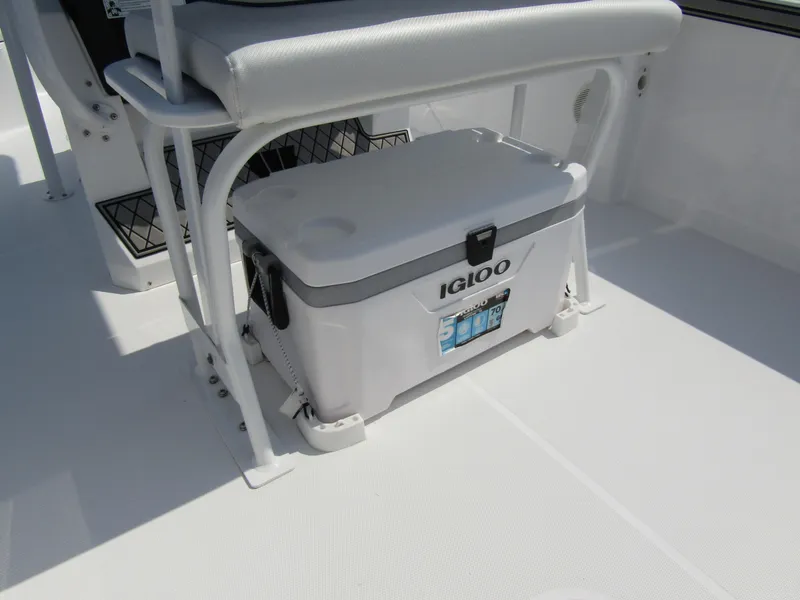 Slide: The Image of 2024 Wellcraft 202 Fisherman boat interior with Igloo cooler under seat. - 24