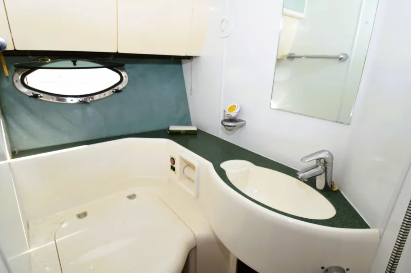 Slide: The Image of Bathroom interior of 1999 Fairline Targa 43 yacht with sink and porthole window. - 10