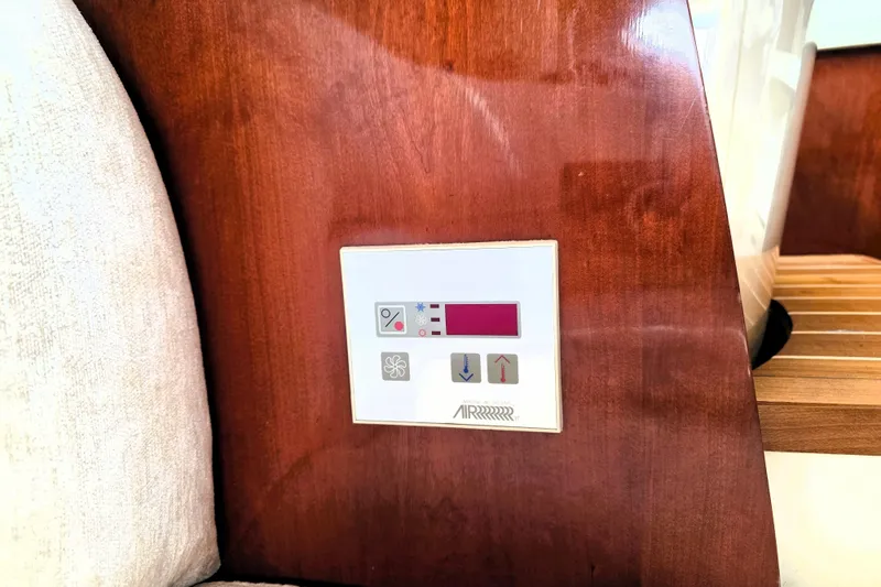 Slide: The Image of Control panel on 1999 Fairline Targa 43 yacht, featuring temperature and fan settings. - 20