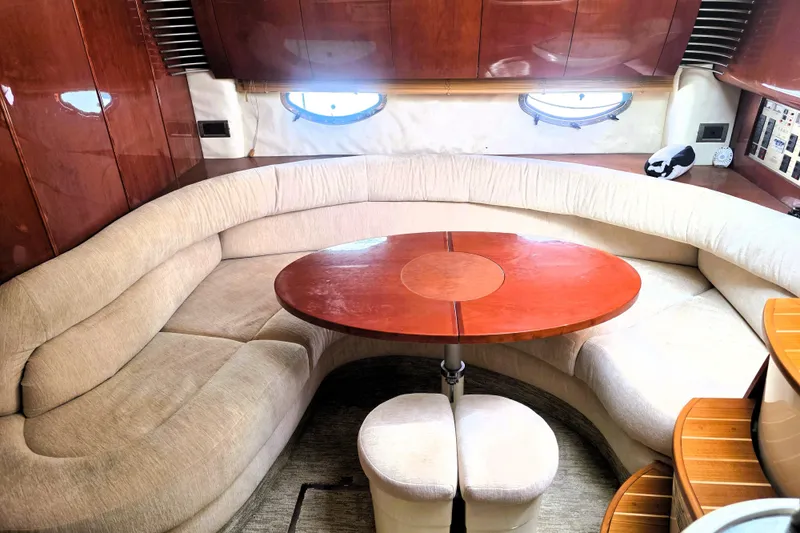 Slide: The Image of Luxurious interior of 1999 Fairline Targa 43 yacht with plush seating and wooden table. - 23