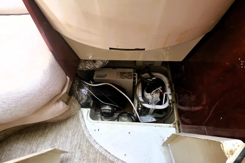 Slide: The Image of Engine compartment of a 1999 Fairline Targa 43 yacht, showing mechanical components. - 26