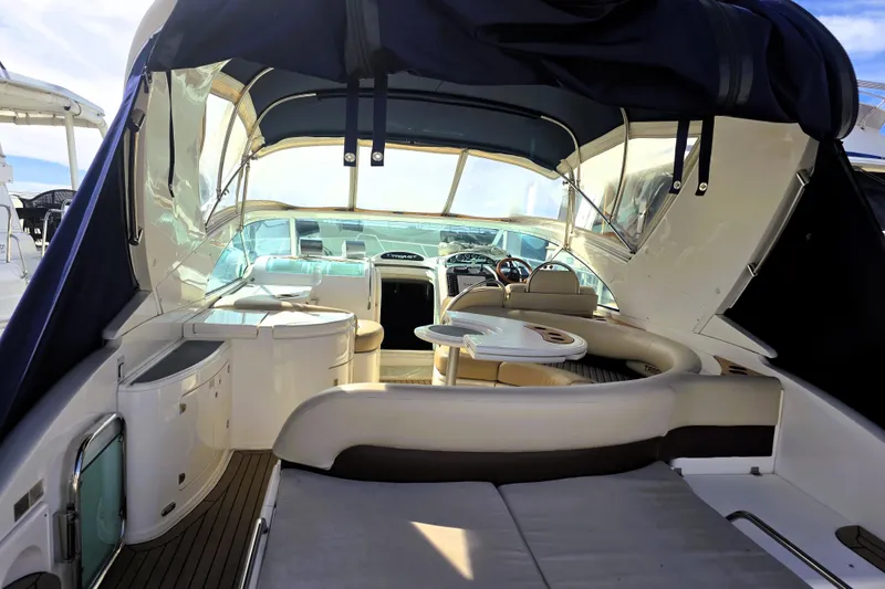Slide: The Image of 1999 Fairline Targa 43 yacht interior with seating, table, and helm station. - 33
