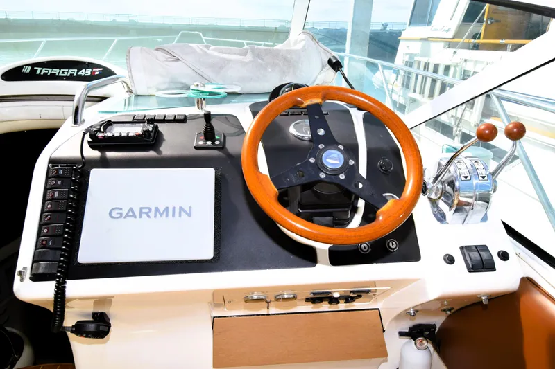 Slide: The Image of Cockpit of 1999 Fairline Targa 43 with Garmin navigation system and wooden steering wheel. - 40