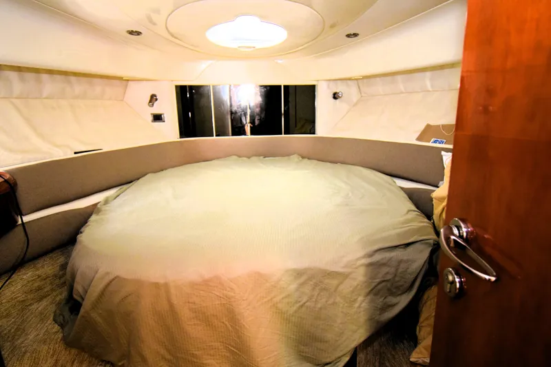 Slide: The Image of 1999 Fairline Targa 43 yacht interior with cozy circular bed and modern design. - 7