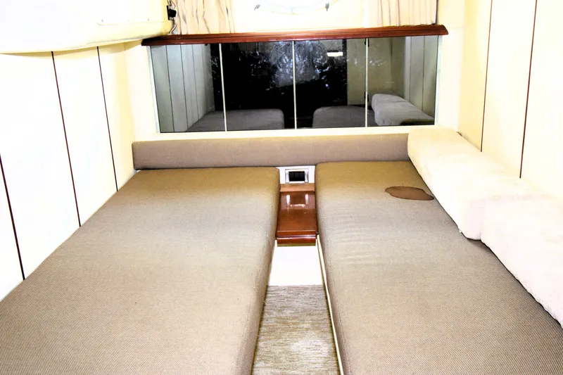 Slide: The Image of Interior cabin of 1999 Fairline Targa 43 yacht with twin beds and mirror. - 8