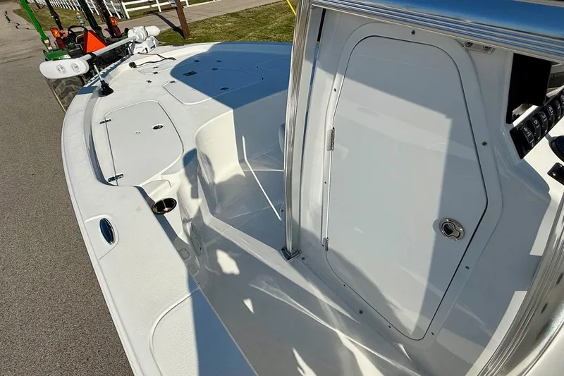 Slide: The Image of 2017 Sea Hunt BX 22 BR boat deck with storage compartments and sleek design. - 13