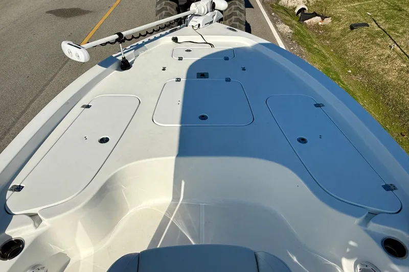 Slide: The Image of 2017 Sea Hunt BX 22 BR boat deck with storage compartments and trolling motor. - 15