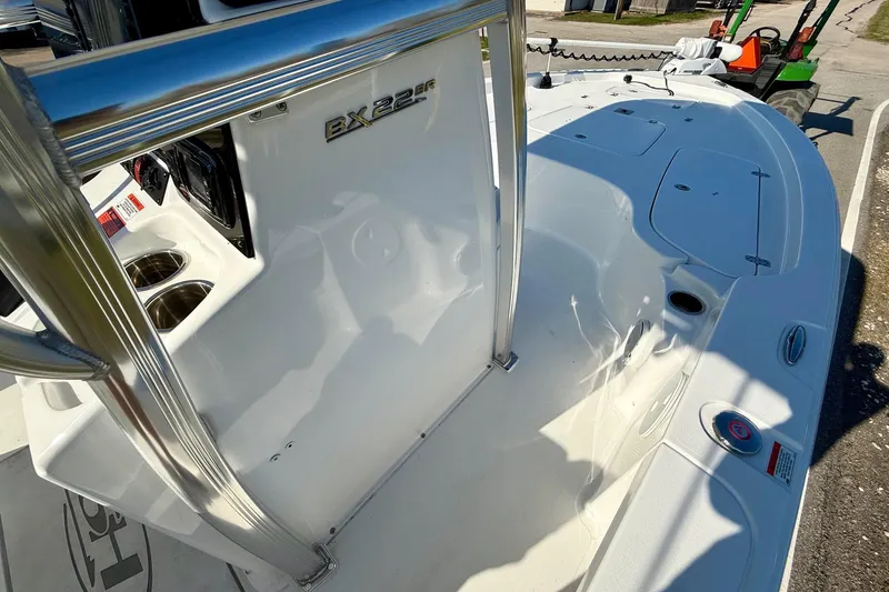 Slide: The Image of 2017 Sea Hunt BX 22 BR boat interior with console and seating area. - 16