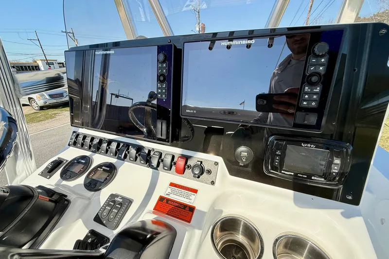 Slide: The Image of Control panel of a 2017 Sea Hunt BX 22 BR boat with navigation displays. - 18