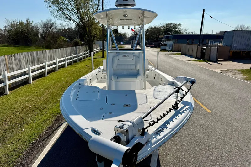 Slide: The Image of 2017 Sea Hunt BX 22 BR boat on a road, featuring a trolling motor. - 6