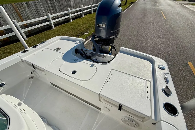 Slide: The Image of 2017 Sea Hunt BX 22 BR boat with Yamaha 200 engine, parked on a road. - 8