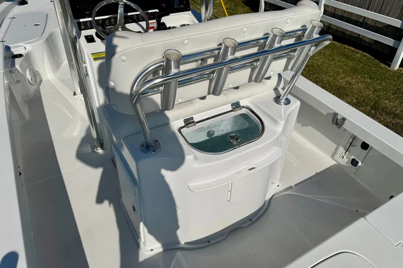 Slide: The Image of 2017 Sea Hunt BX 22 BR boat interior with rod holders and livewell. - 9