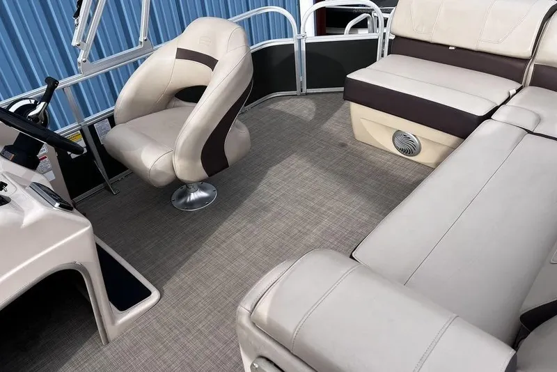 Slide: The Image of 2026 Sun Tracker Party Barge 20 DLX interior with plush seating and modern design. - 14