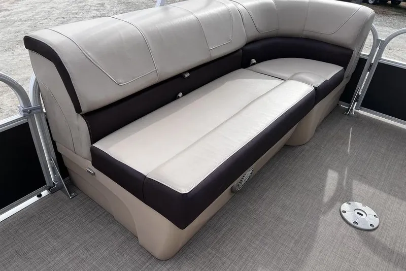 Slide: The Image of 2026 Sun Tracker Party Barge 20 DLX interior seating with beige and brown upholstery. - 16