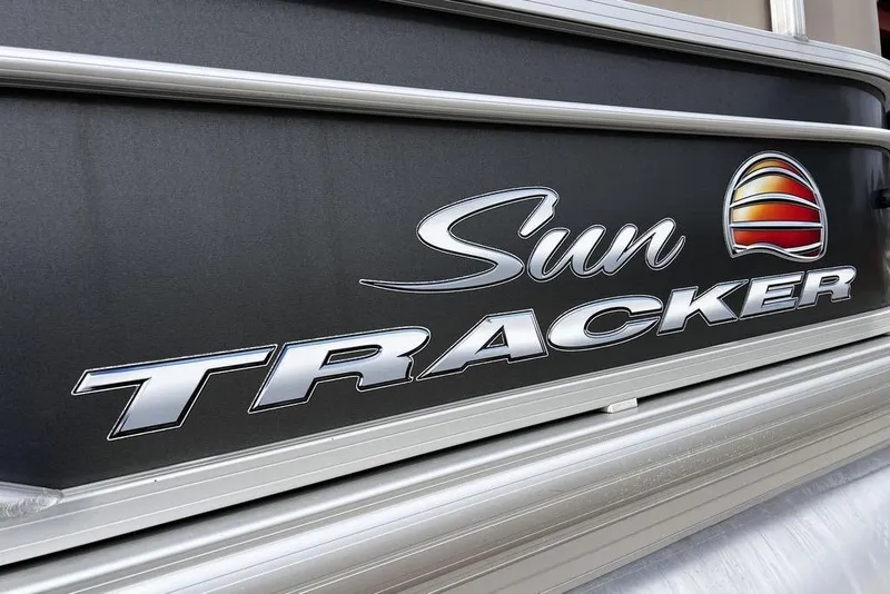 Slide: The Image of 2026 Sun Tracker Party Barge 20 DLX logo on boat exterior. - 3