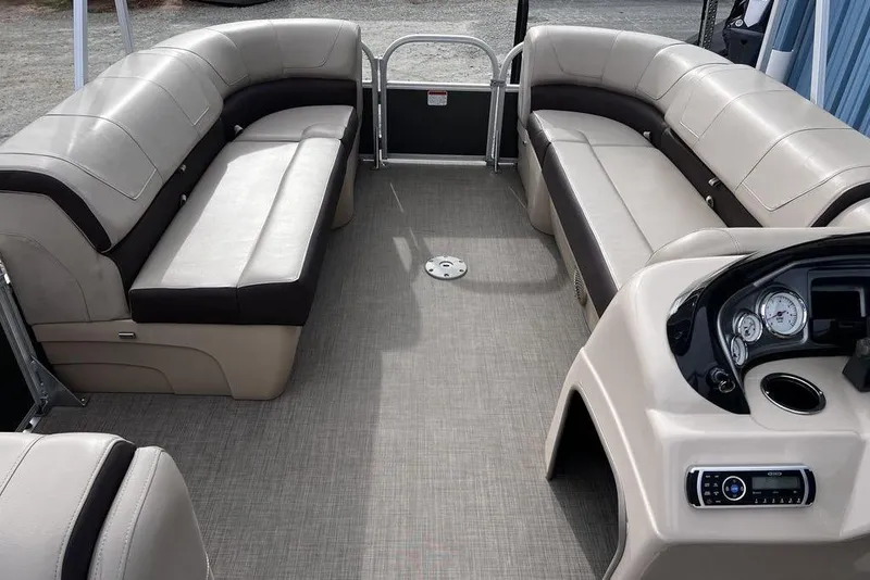 Slide: The Image of 2026 Sun Tracker Party Barge 20 DLX interior with spacious seating and modern dashboard. - 9
