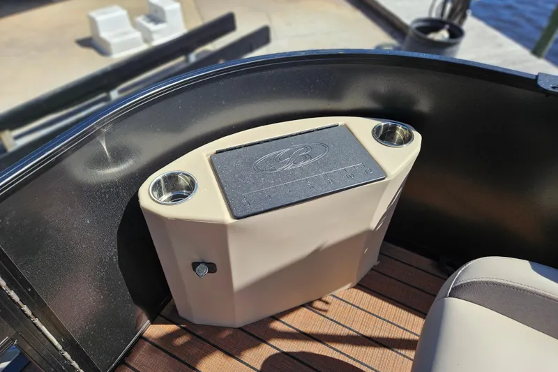 Slide: The Image of 2026 Bentley Pontoons Fish 243 Center Walk Through interior detail with cup holders. - 12