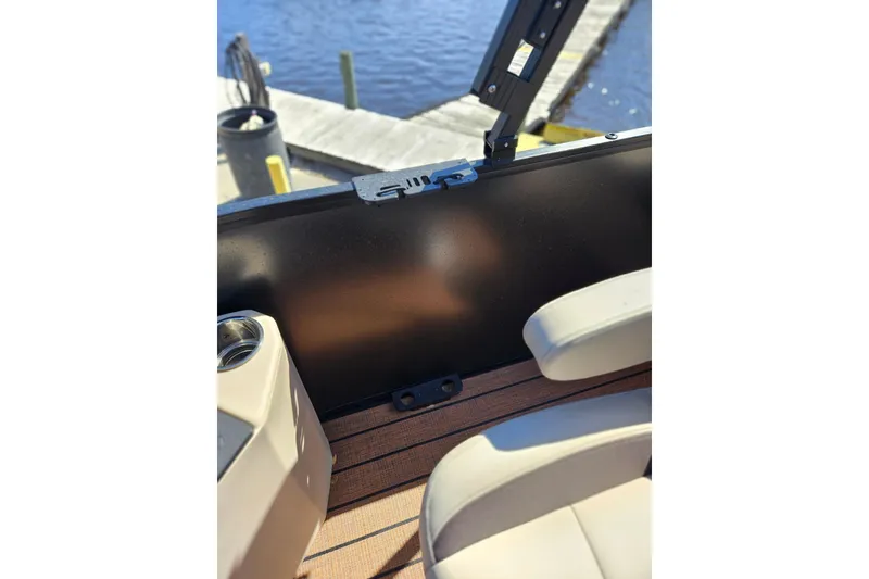 Slide: The Image of Interior view of 2026 Bentley Pontoons Fish 243 Center Walk Through, featuring seating and dockside. - 13