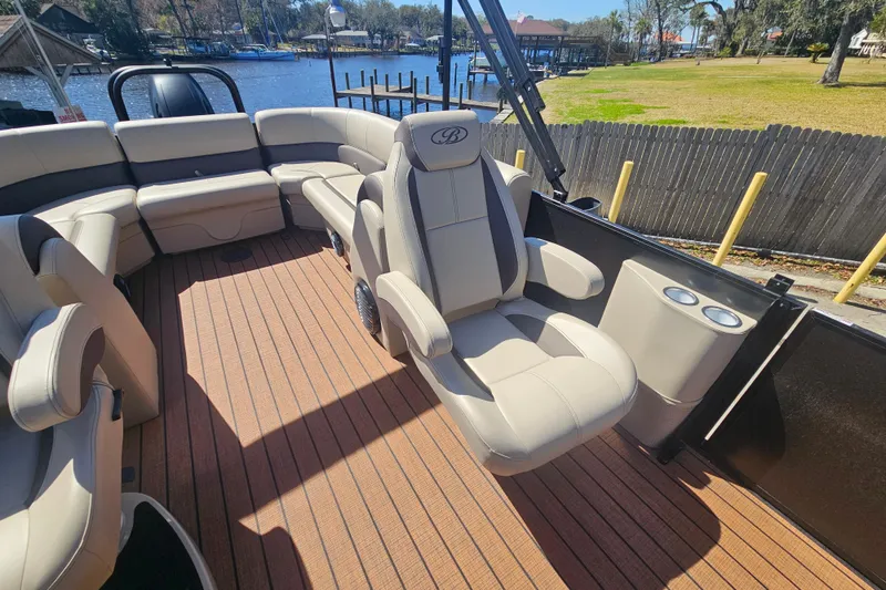 Slide: The Image of 2026 Bentley Pontoons Fish 243 Center Walk Through interior with luxurious seating and cup holders. - 19